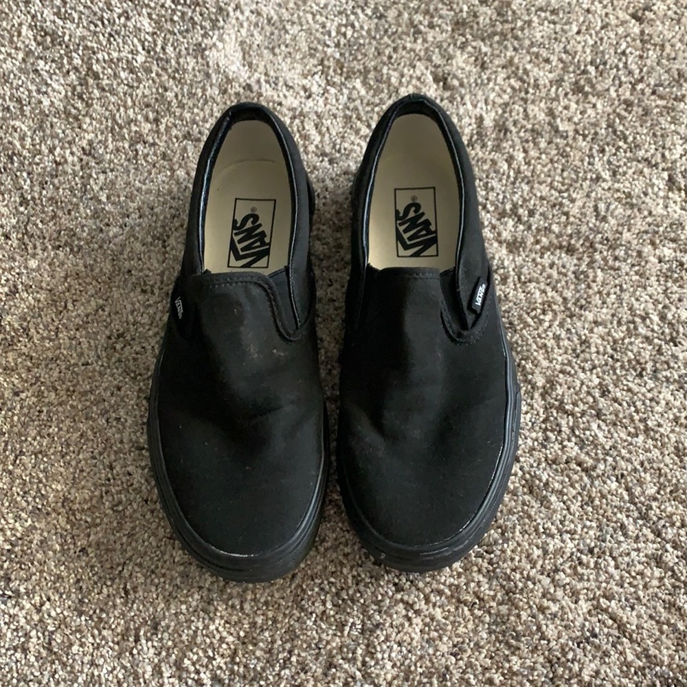 All black slip on vans